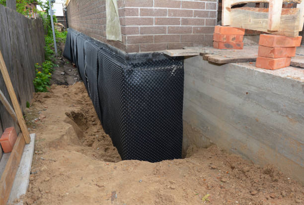 Happy homeowners after waterproofing job in Little Ferry